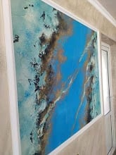 Abstract painting with blue and turquoise tones, black brushstrokes, and textured details